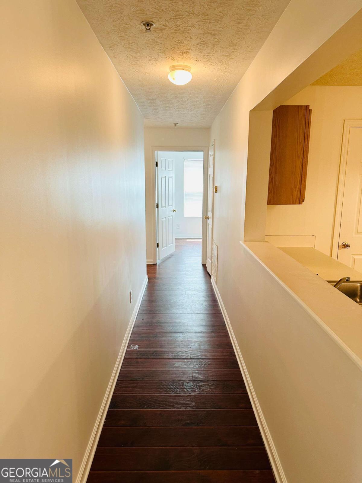 2204 Waldrop Place Decatur, GA 30034 - Photo 6 of 20 a view of a hallway with wooden floor