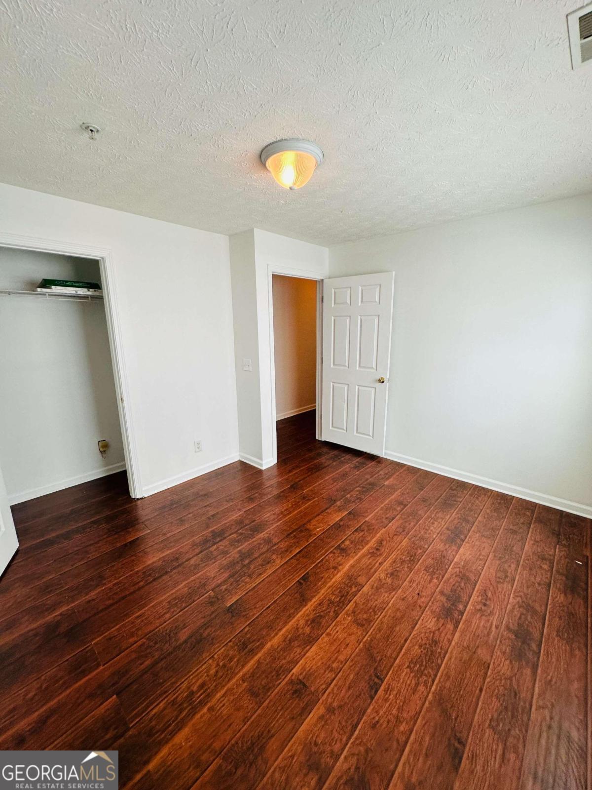 2204 Waldrop Place Decatur, GA 30034 - Photo 7 of 20 a view of empty room with wooden floor