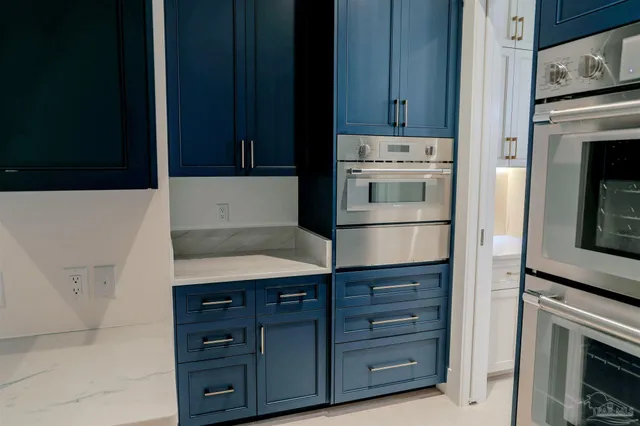 a kitchen with cabinets and white appliances