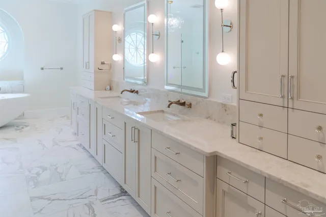 a bathroom with a bathtub and shower