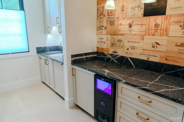 an empty room with a bathroom and a window