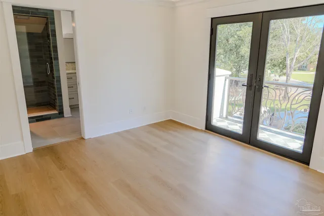 a bathroom with a granite countertop sink a mirror and a toilet