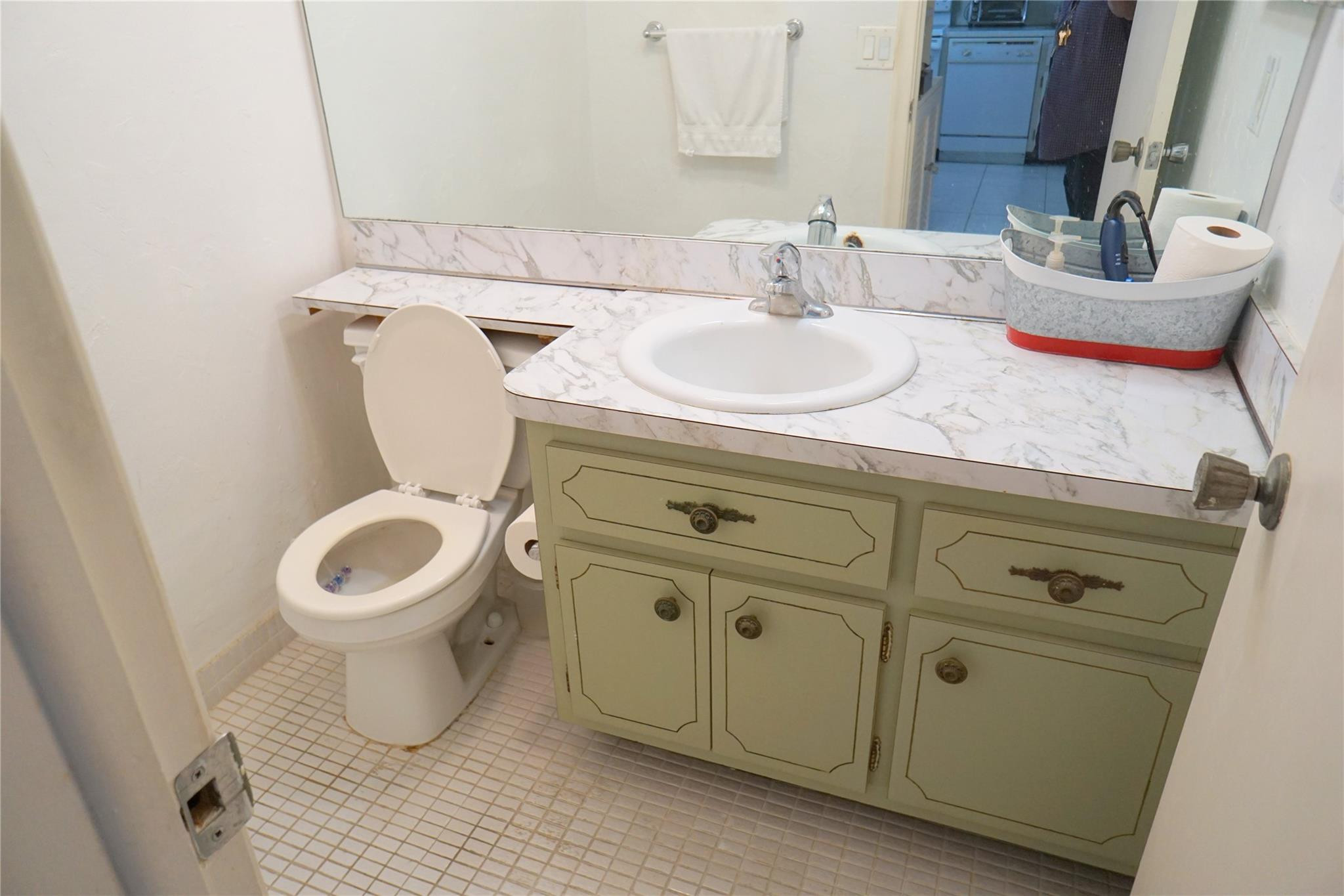 303 North Riverside Drive, Unit PH4 Pompano Beach, FL 33062 - Photo 23 of 52 a bathroom with a toilet sink and mirror