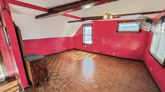 a bathroom with a granite countertop toilet sink and mirror
