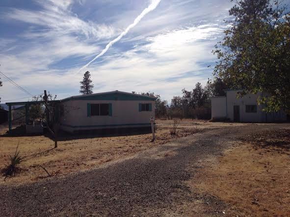 5821 Beagle Road White City, OR 97503 - Photo 2 of 28 a front view of a house with a yard