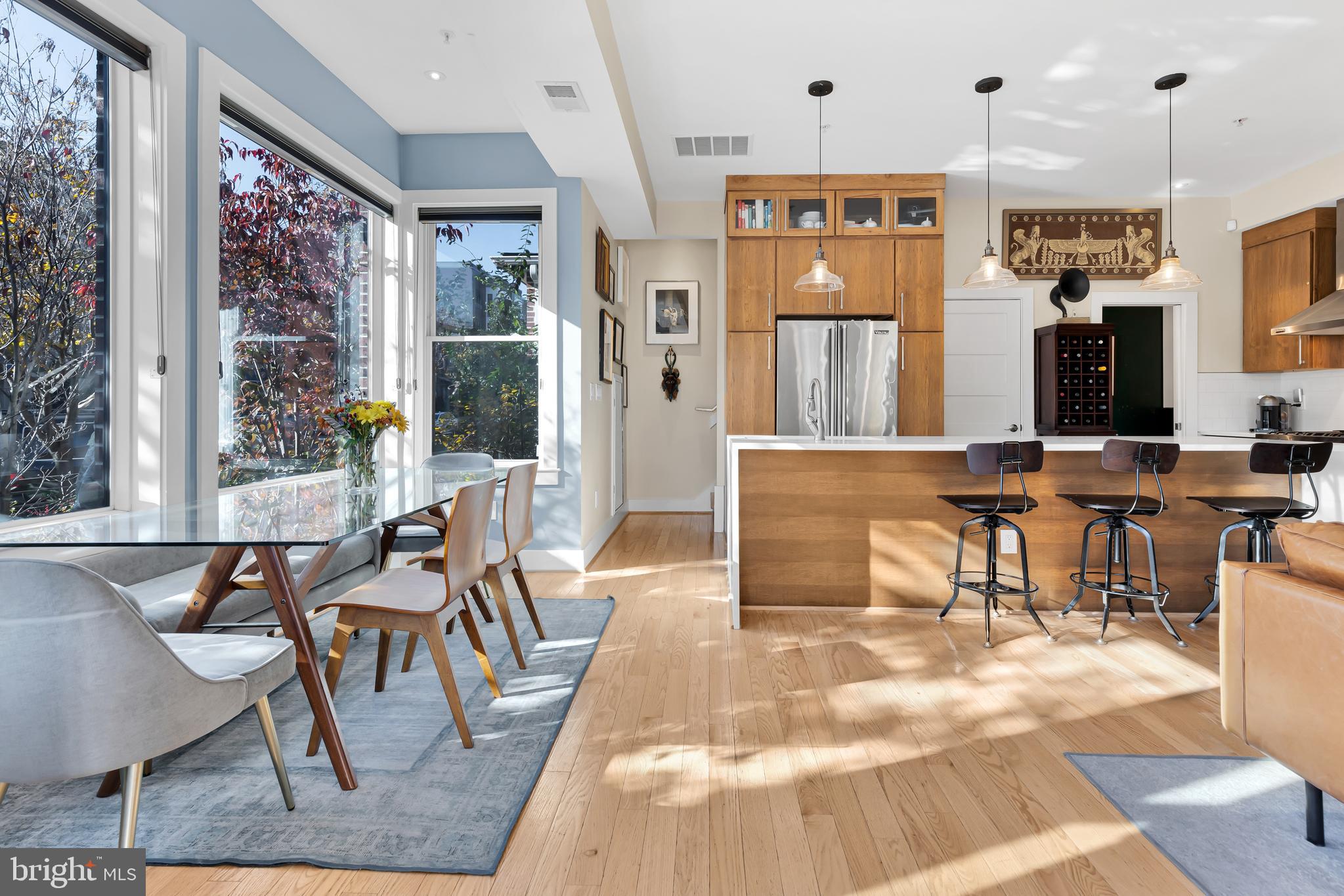 963 14th Street Southeast, Unit 1 Washington, DC 20003 - Photo 5 of 12 a living room with stainless steel appliances kitchen island granite countertop furniture and a large window