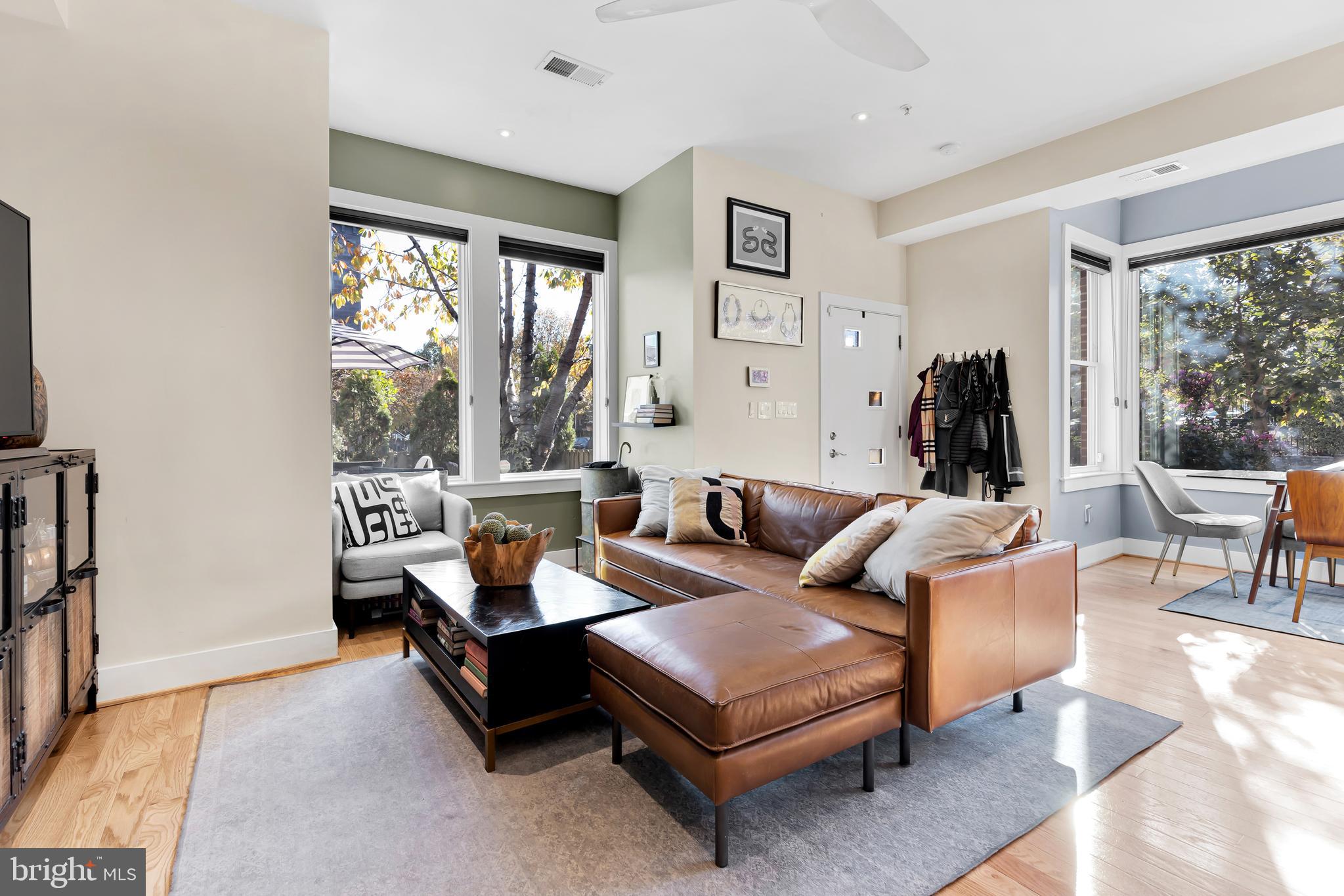 963 14th Street Southeast, Unit 1 Washington, DC 20003 - Photo 6 of 12 a living room with furniture and a large window