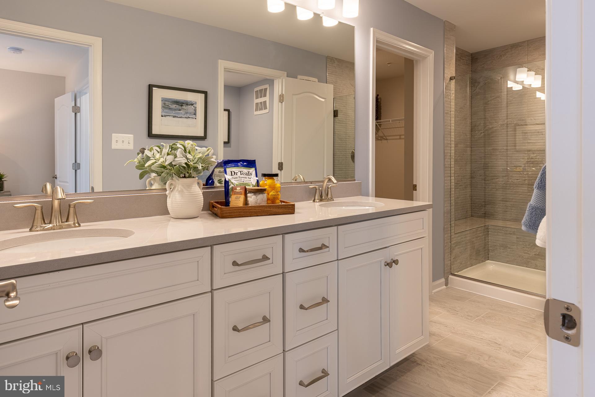 95 Central Avenue Gaithersburg, MD 20877 - Photo 6 of 15 a bathroom with double sink and a mirror