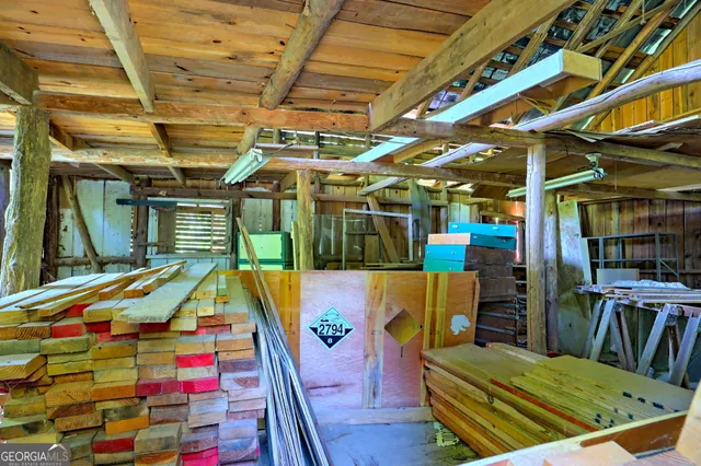 an aerial view of a house with yard