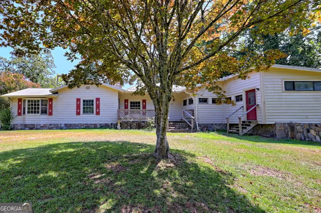 a view of a forest with a houses