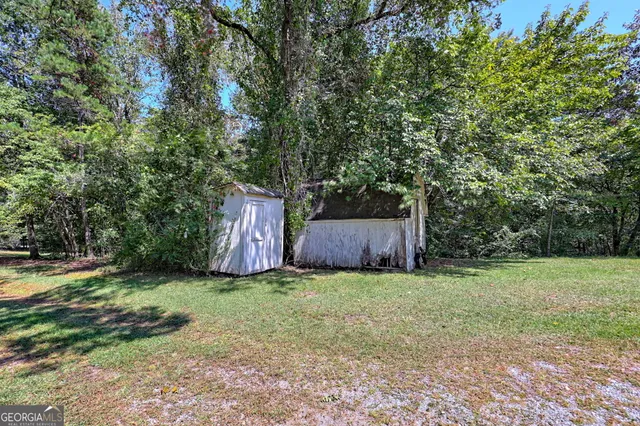 a view of a city with lush green forest