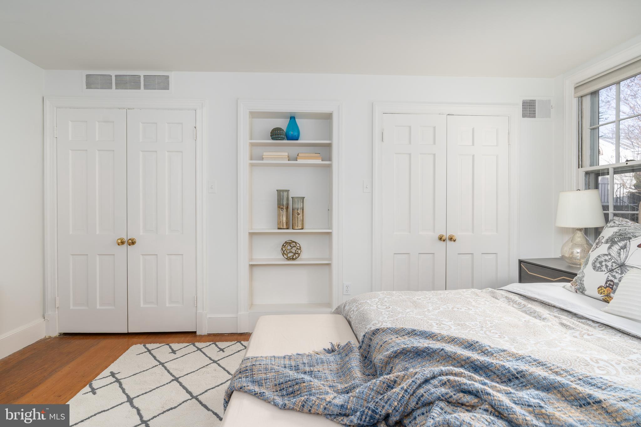3339 P Street Northwest Washington, DC 20007 - Photo 12 of 21 wall of closets and built-ins in primary bedroom