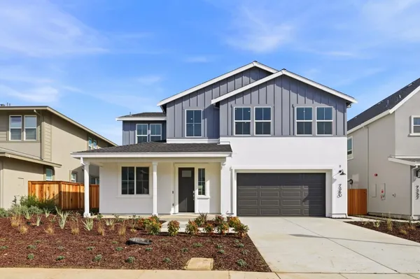 a front view of a house with yard
