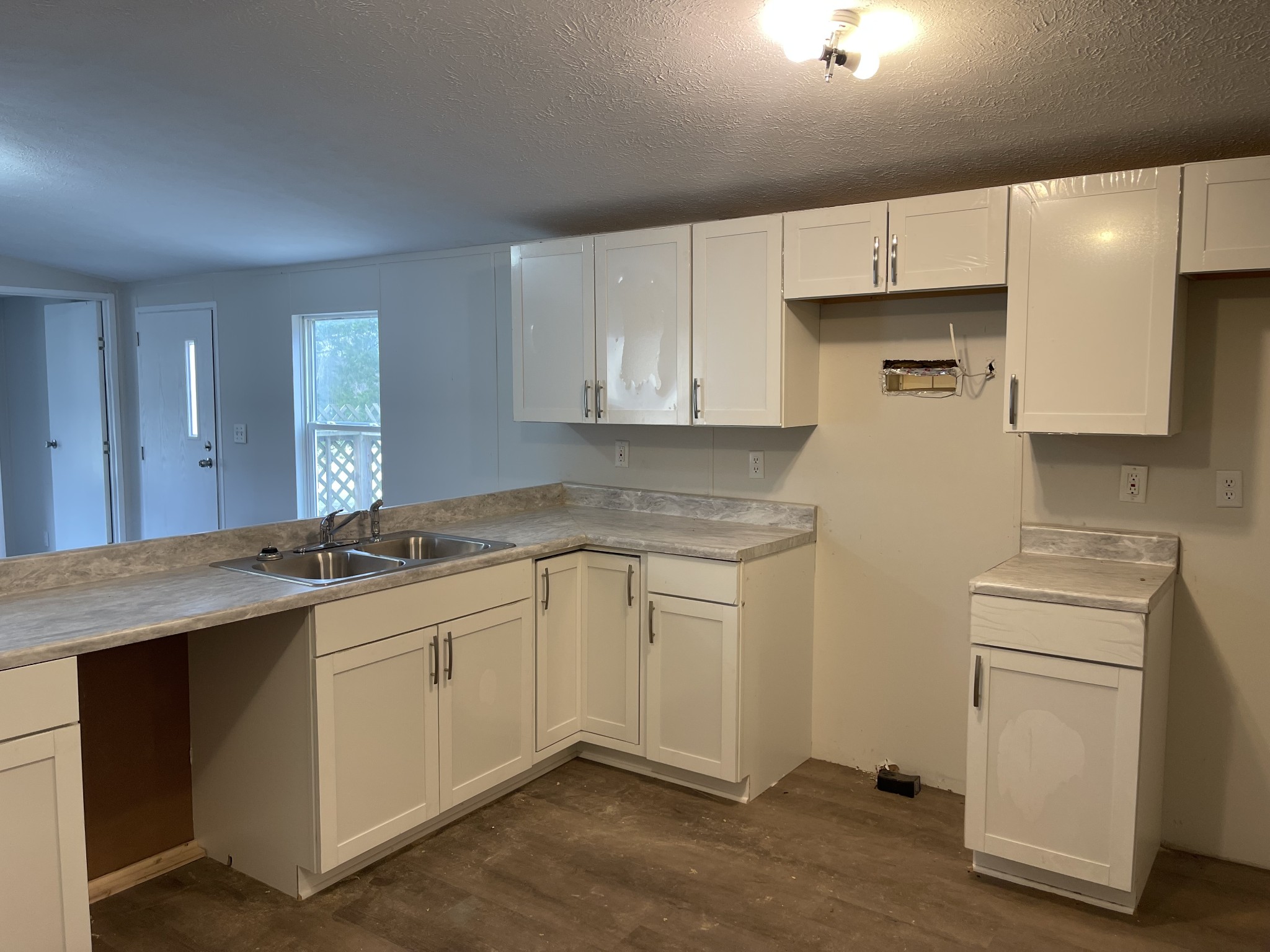120 March Mill Road Fayetteville, TN 37334 - Photo 13 of 21 a kitchen with a sink stove and cabinets