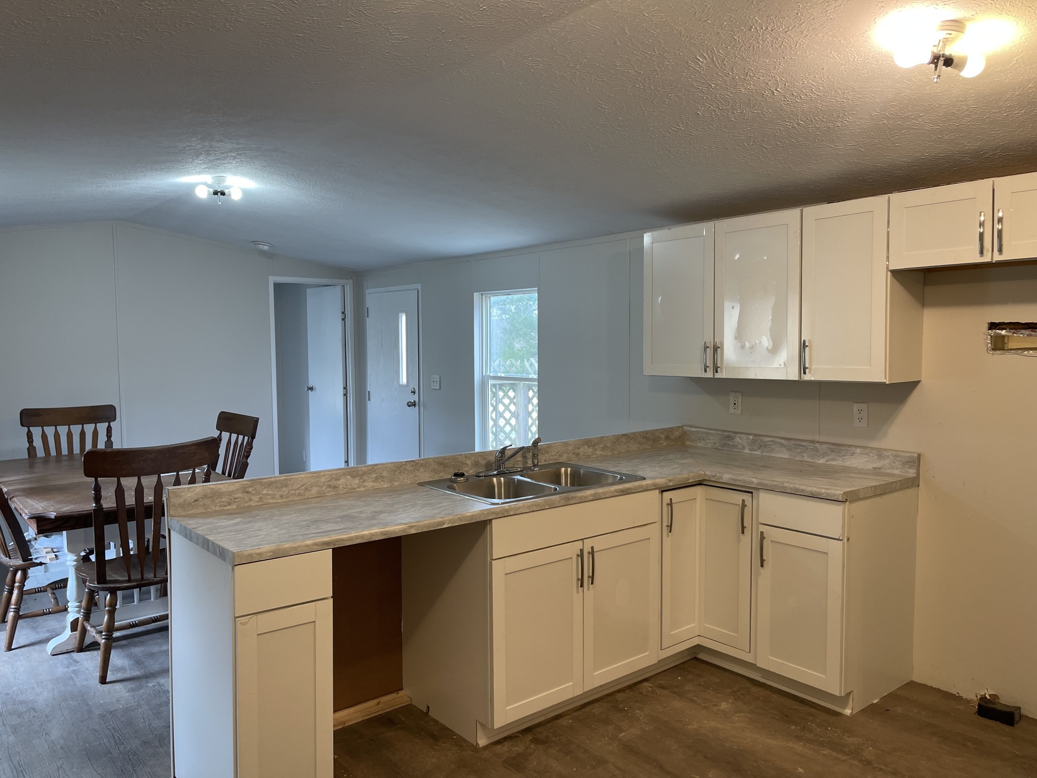 120 March Mill Road Fayetteville, TN 37334 - Photo 15 of 21 a kitchen with a sink cabinets and wooden floor