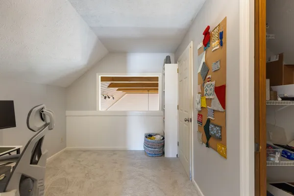 a bedroom with a bed and a view of bathroom