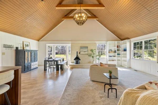 a kitchen with stainless steel appliances kitchen island granite countertop a refrigerator and a cabinets