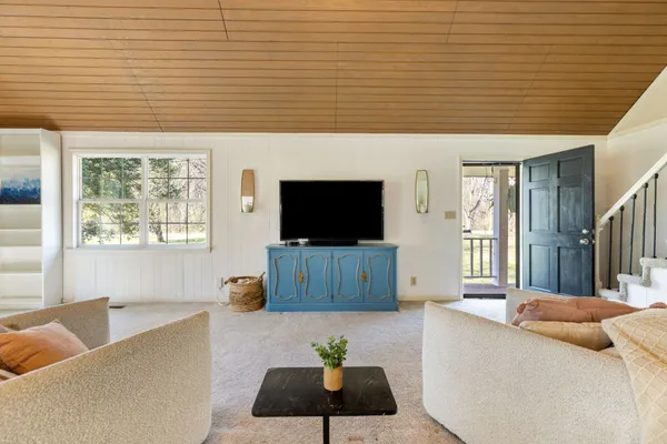a view of a dining room with furniture window and outside view