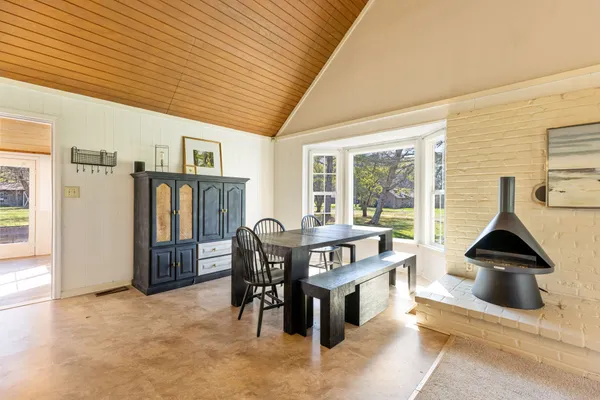 a view of living room filled with furniture and floor to ceiling window