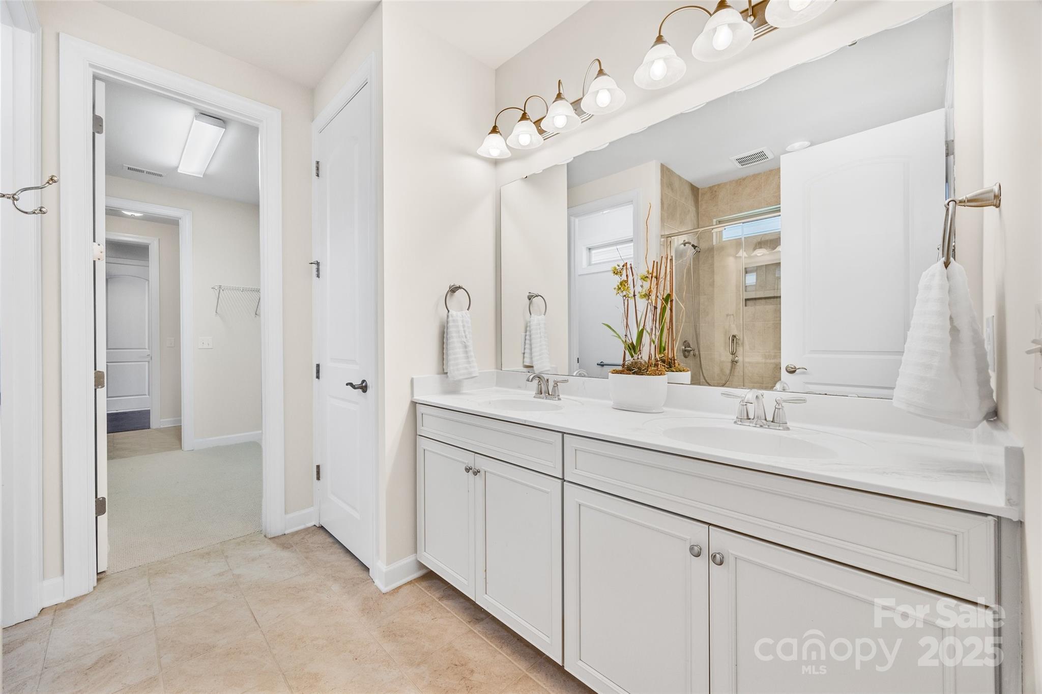 1268 Independence Street Tega Cay, SC 29708 - Photo 15 of 29 a bathroom with a sink double vanity and a mirror
