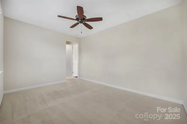 a view of a big room with carpet