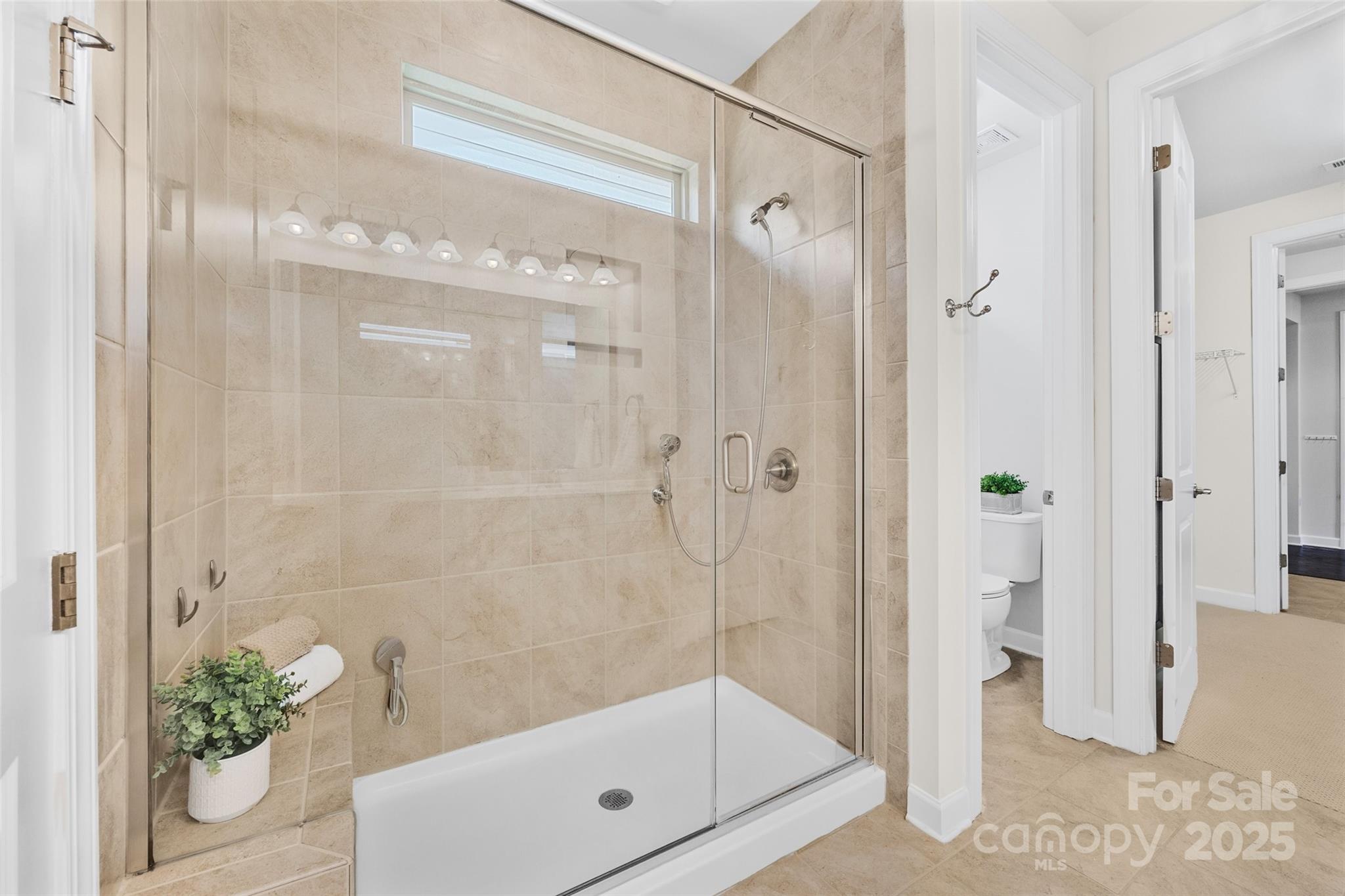 1268 Independence Street Tega Cay, SC 29708 - Photo 16 of 29 a bathroom with a shower and a tub