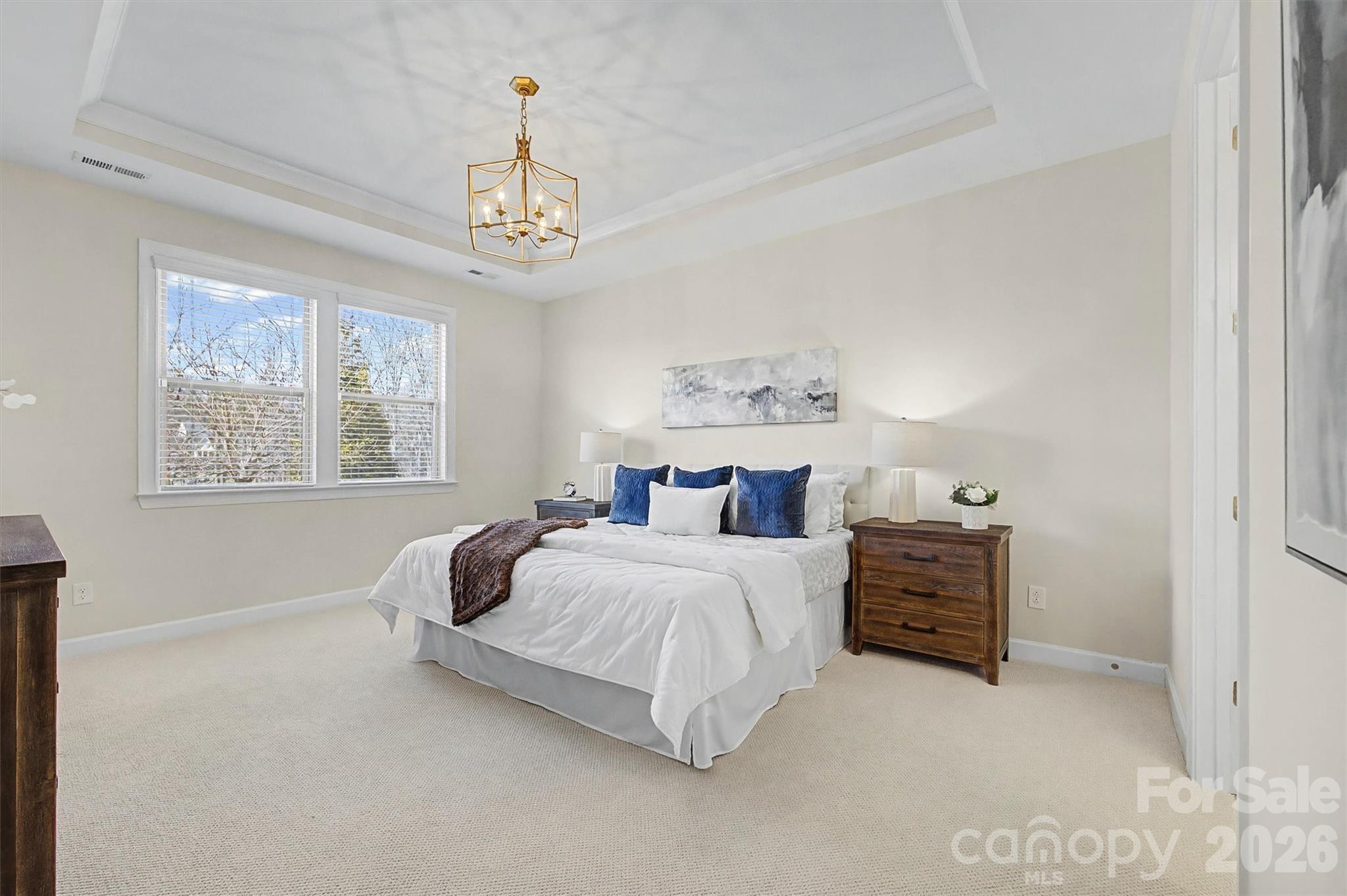 1268 Independence Street Tega Cay, SC 29708 - Photo 18 of 38 a bedroom with bed and window