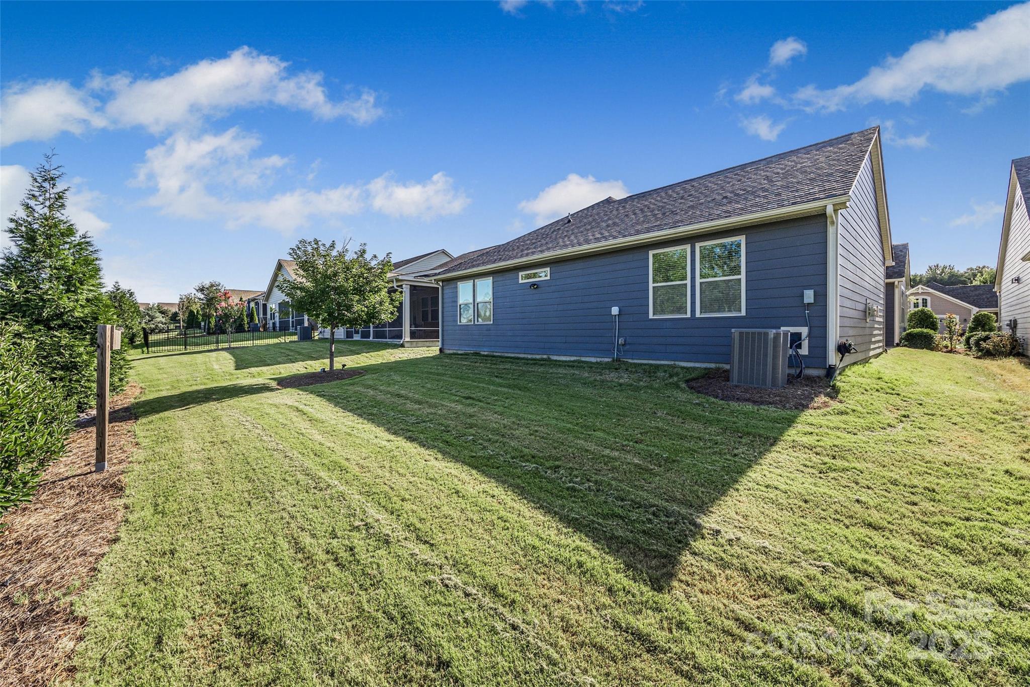 1268 Independence Street Tega Cay, SC 29708 - Photo 21 of 29 a view of a house with a big yard