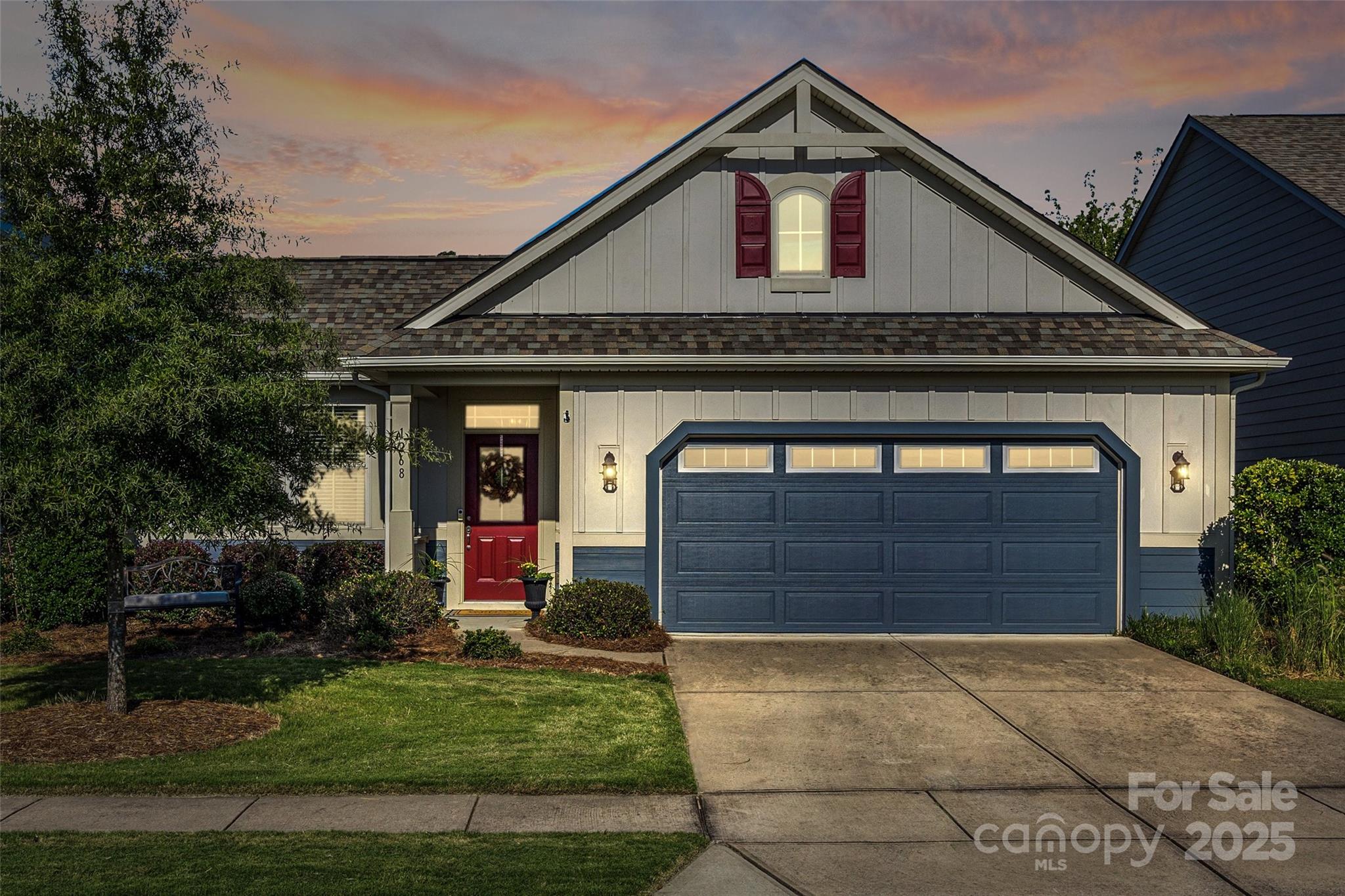1268 Independence Street Tega Cay, SC 29708 - Photo 22 of 29 a front view of a house with garden