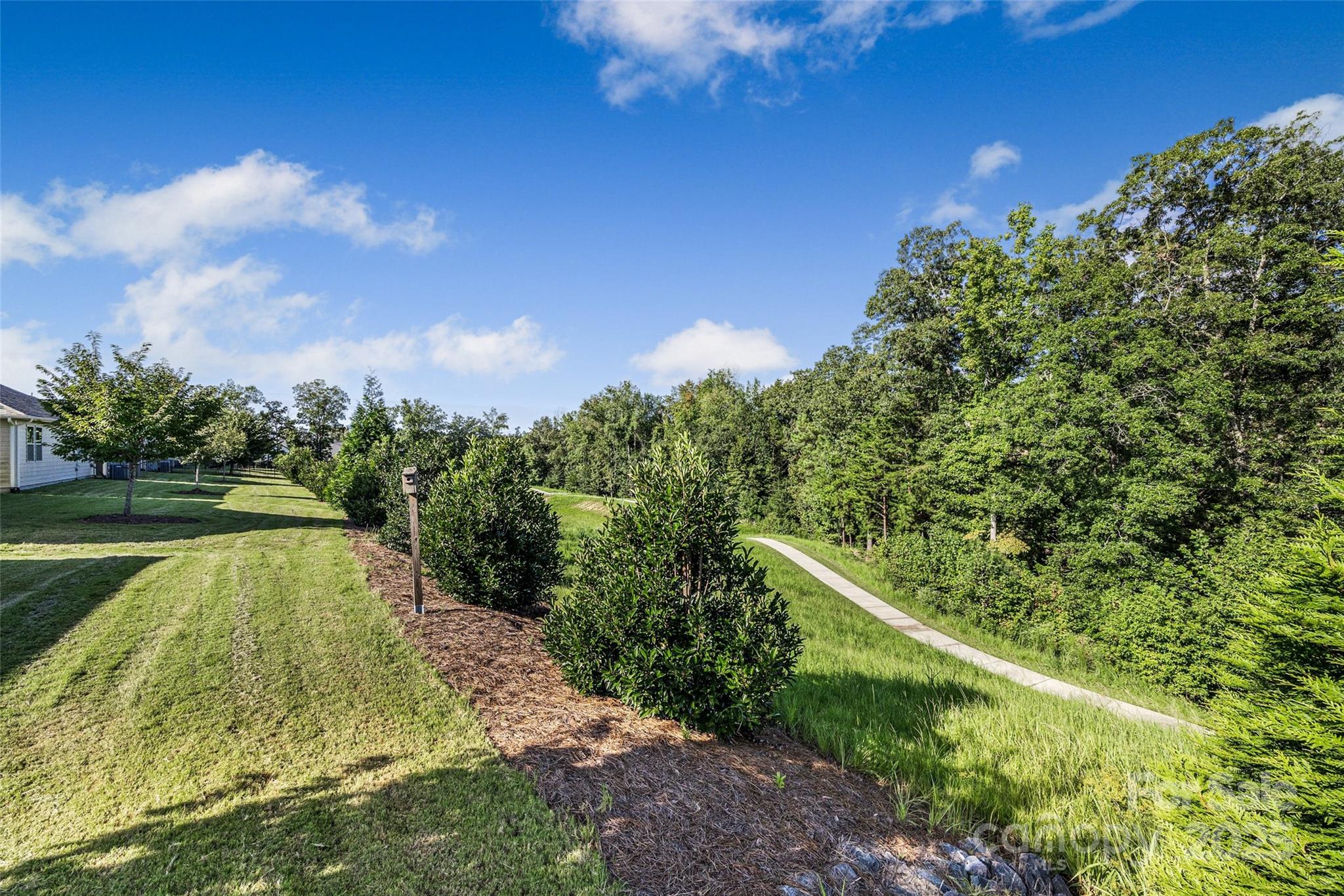 1268 Independence Street Tega Cay, SC 29708 - Photo 23 of 29 a view of a lake with a yard