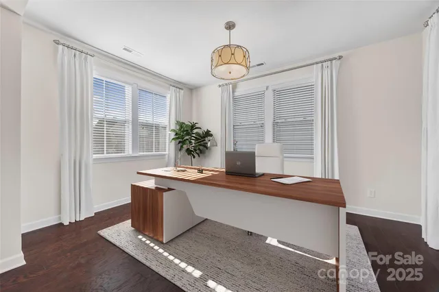 a dining room with table and window
