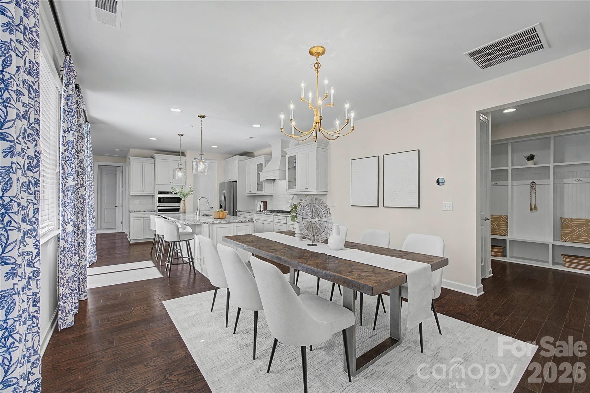 1268 Independence Street Tega Cay, SC 29708 - Photo 9 of 38 a view of a dining room with furniture and wooden floor