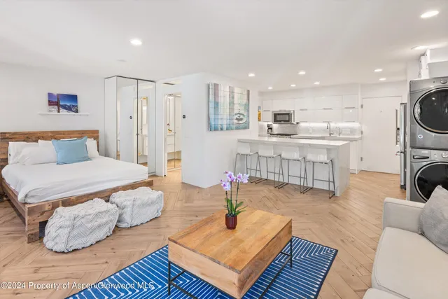 a living room with furniture and a table