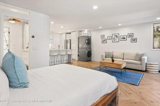 a bedroom with a bed and a couch