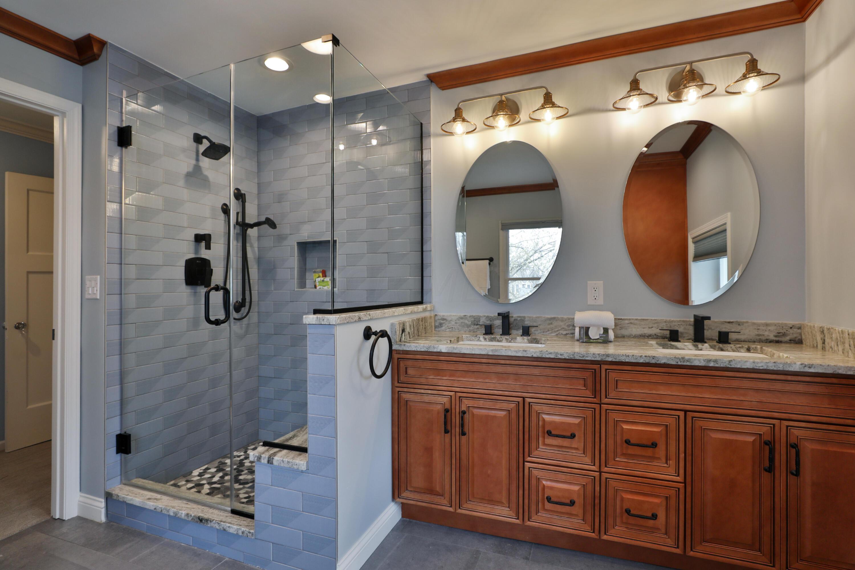 2180 Bryden Road Columbus, OH 43209 - Photo 38 of 56 Double vanity w 2 sinks, sacious shower with seat, bright lighting, and remote controlled blinds.