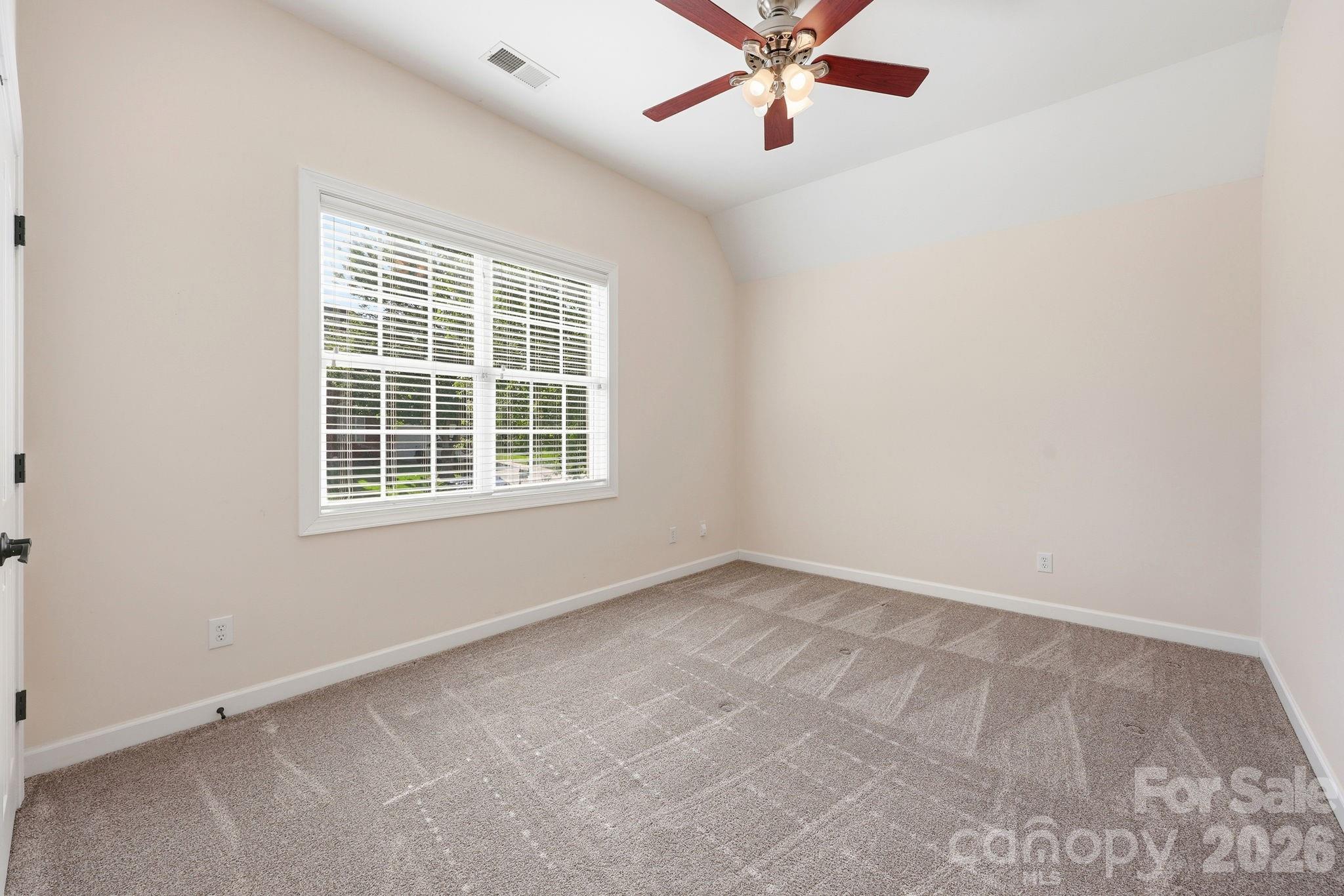 3308 Grandeur Road Charlotte, NC 28269 - Photo 25 of 45 an empty room with a window