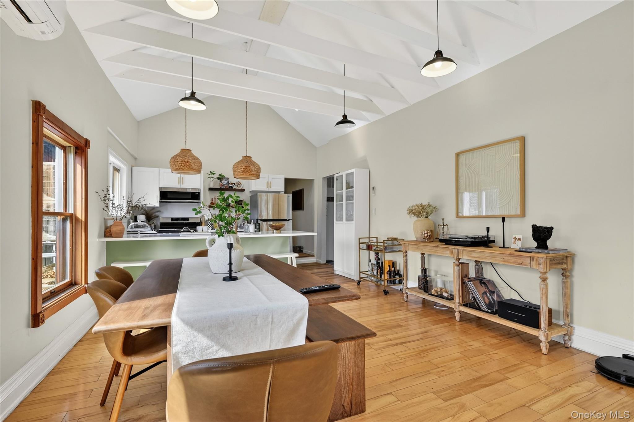 96 Lower Wisner Road Warwick, NY 10990 - Photo 11 of 34 Vaulted ceiling with exposed white beams and pendant lighting
