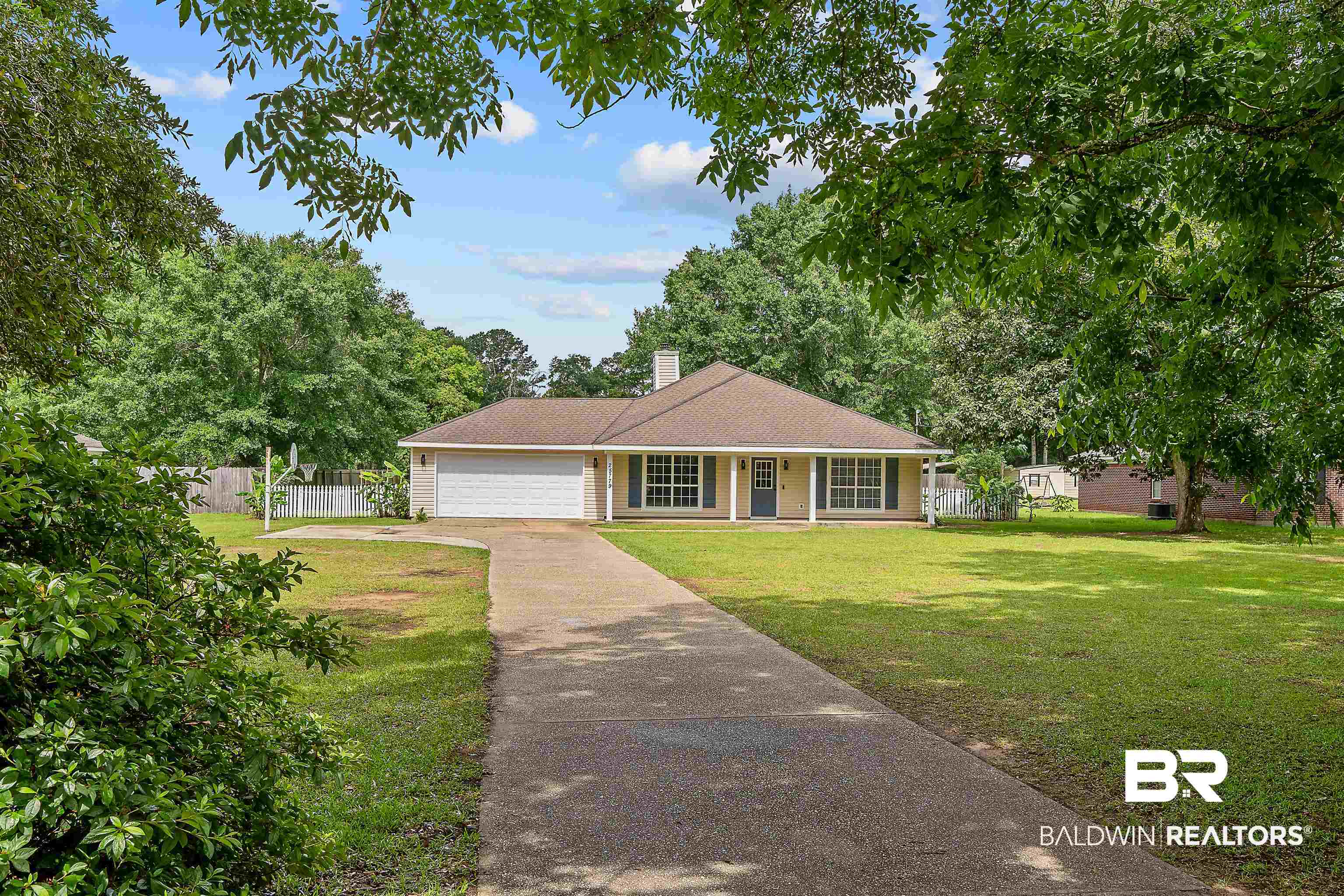 25779 Austin Road Daphne, AL 36526 - Photo 2 of 30 View of front of home with covered porch, an attached garage, concrete driveway, and a chimney
