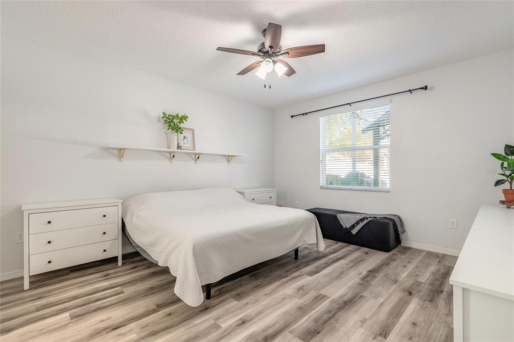 1215 Cap Diville Avenue Port Orange, FL 32129 - Photo 15 of 58 a bedroom with a bed and window