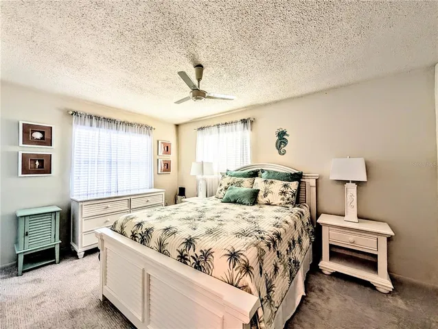 a bedroom with a bed and a fireplace