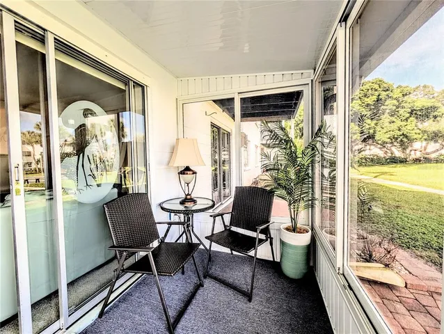 a view of a fountain in front of a building with a big yard