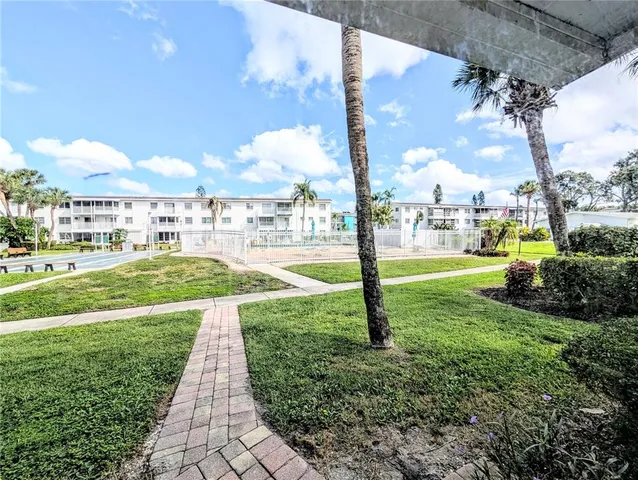 a view of outdoor space with signage and flags