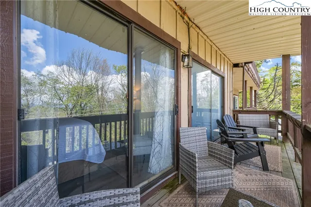 a view of a balcony with chairs