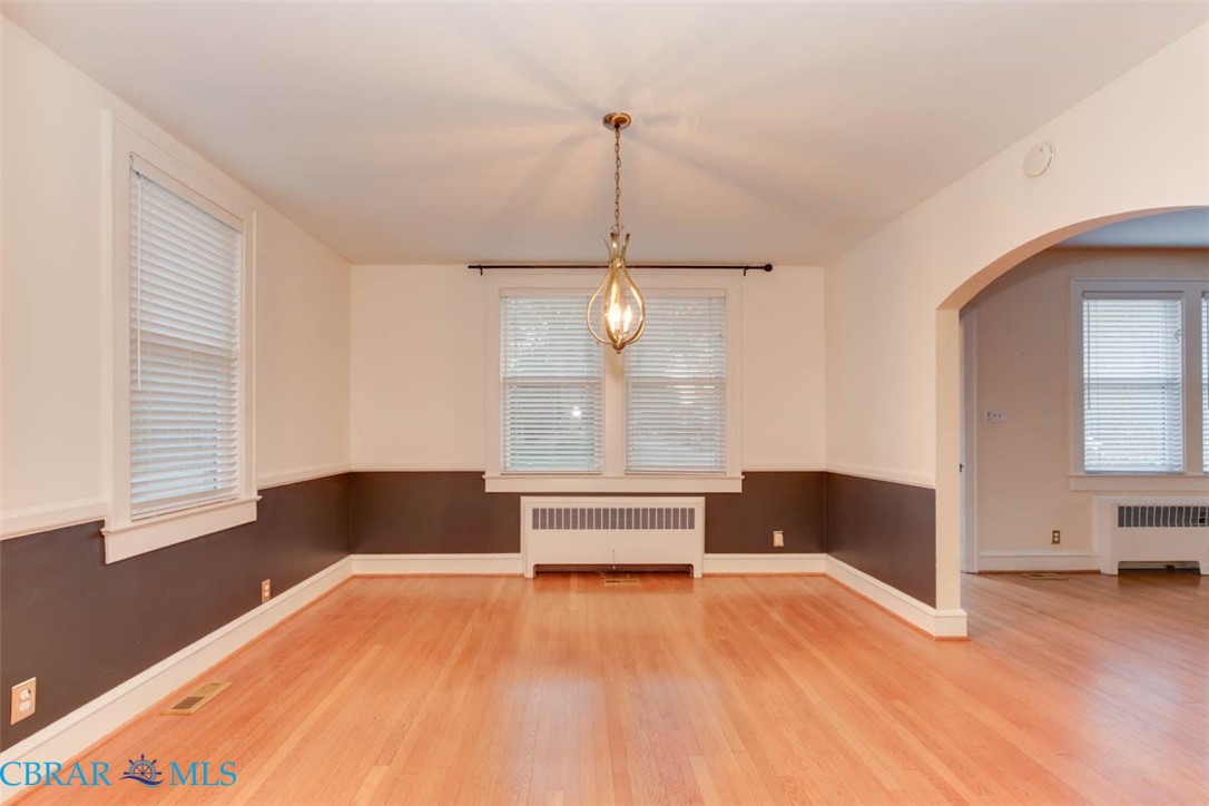 144 Meredith Street Hampton, VA 23669 - Photo 16 of 36 a spacious bedroom with a bed and a window