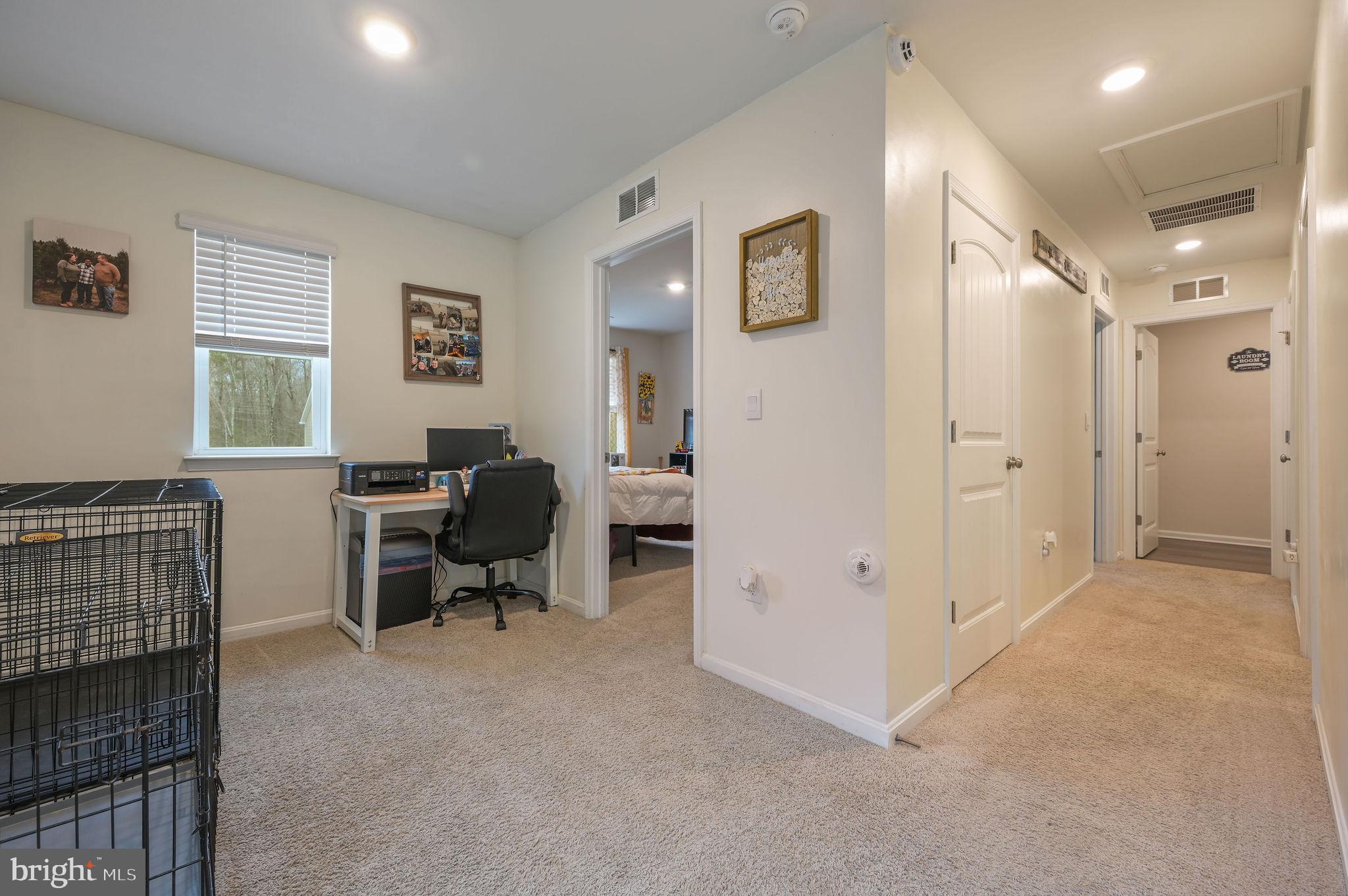 504 Currant Circle Magnolia, DE 19962 - Photo 11 of 27 a view of a workspace with furniture and a window