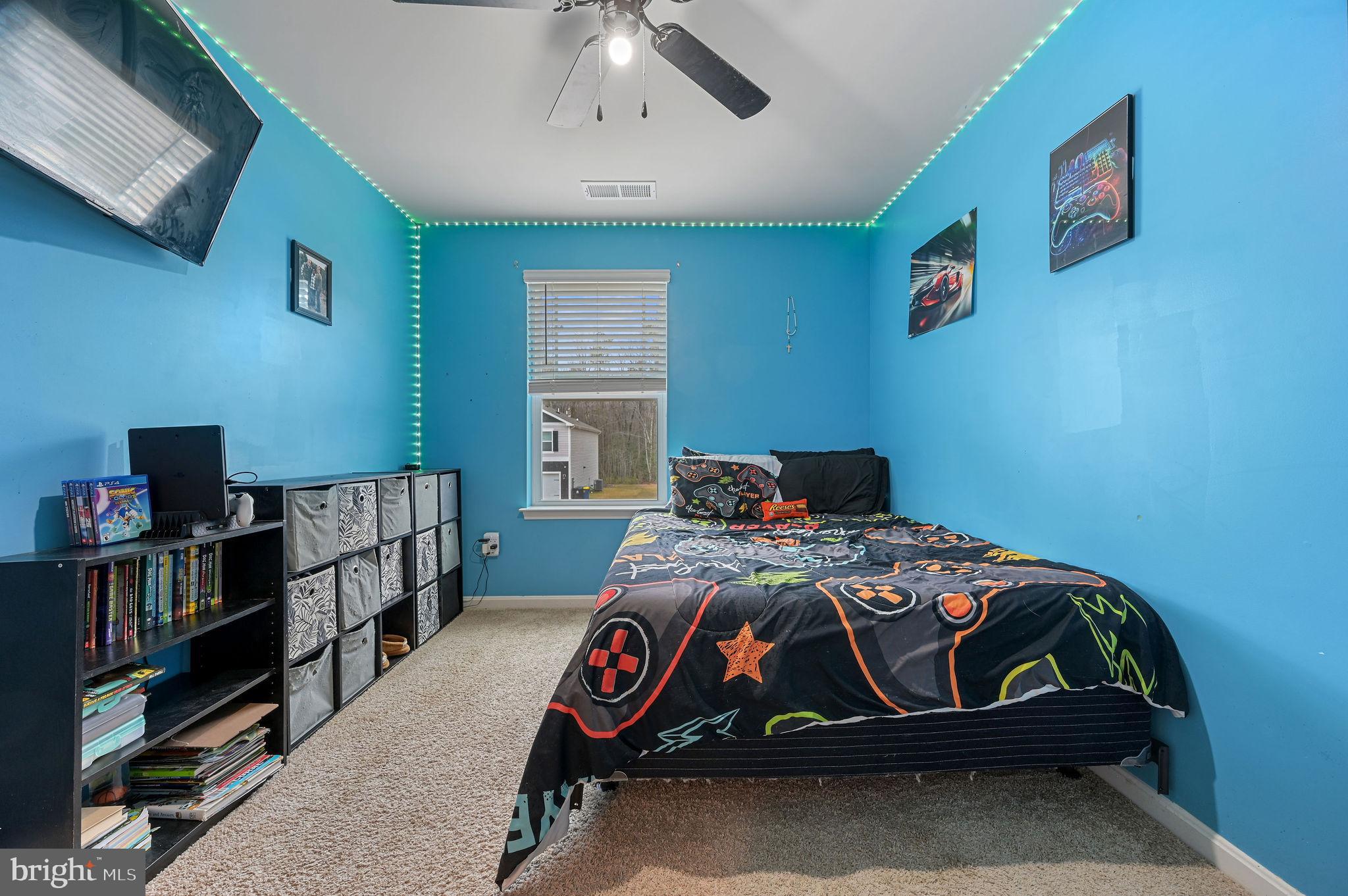 504 Currant Circle Magnolia, DE 19962 - Photo 16 of 27 a bedroom with a bed and a chandelier