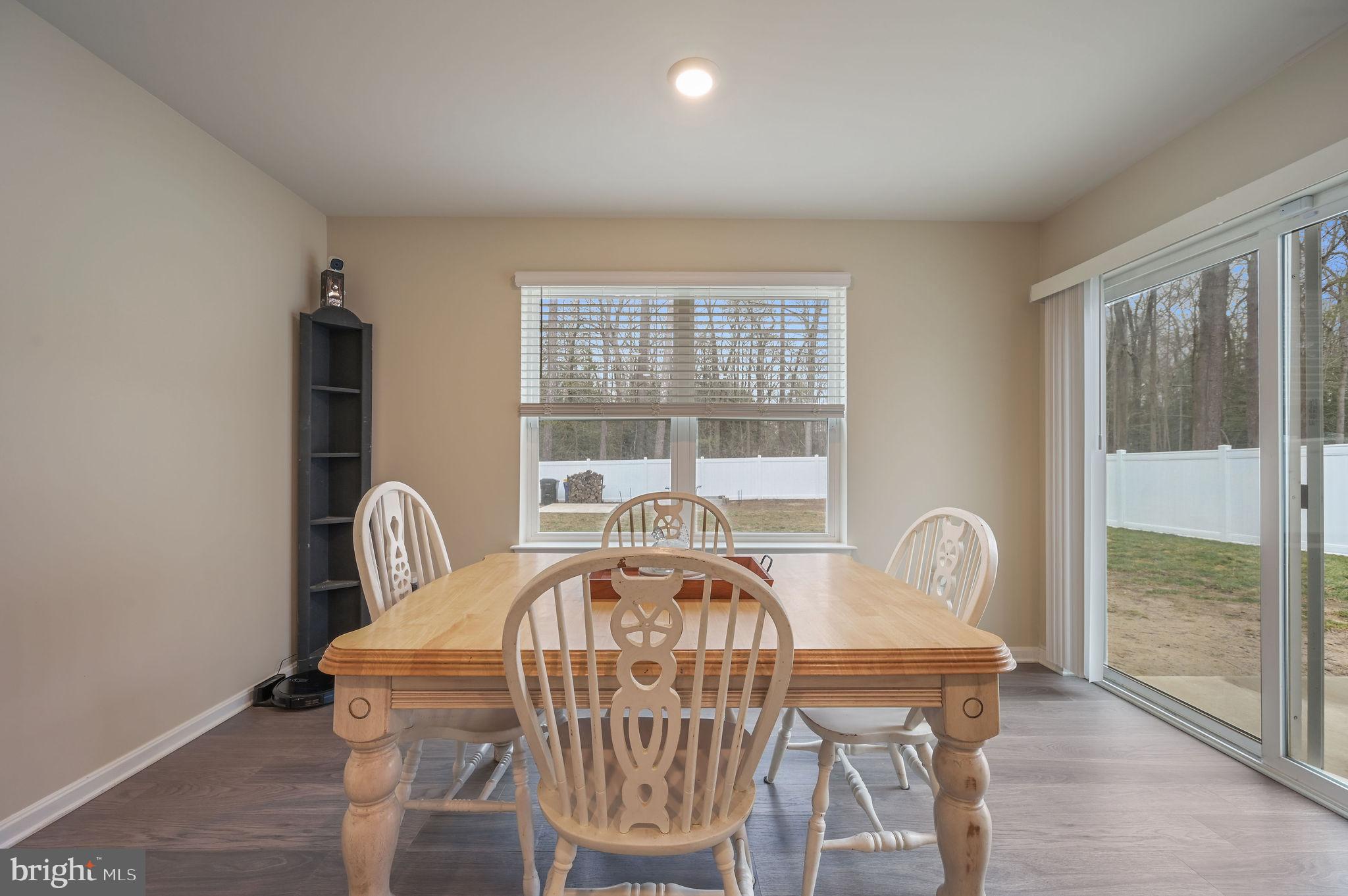 504 Currant Circle Magnolia, DE 19962 - Photo 8 of 27 a view of a balcony dining table and chairs