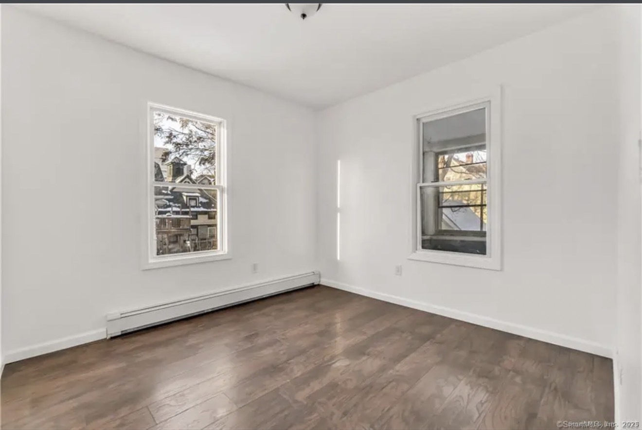 74 Carleton Avenue Bridgeport, CT 06604 - Photo 13 of 15 an empty room with windows