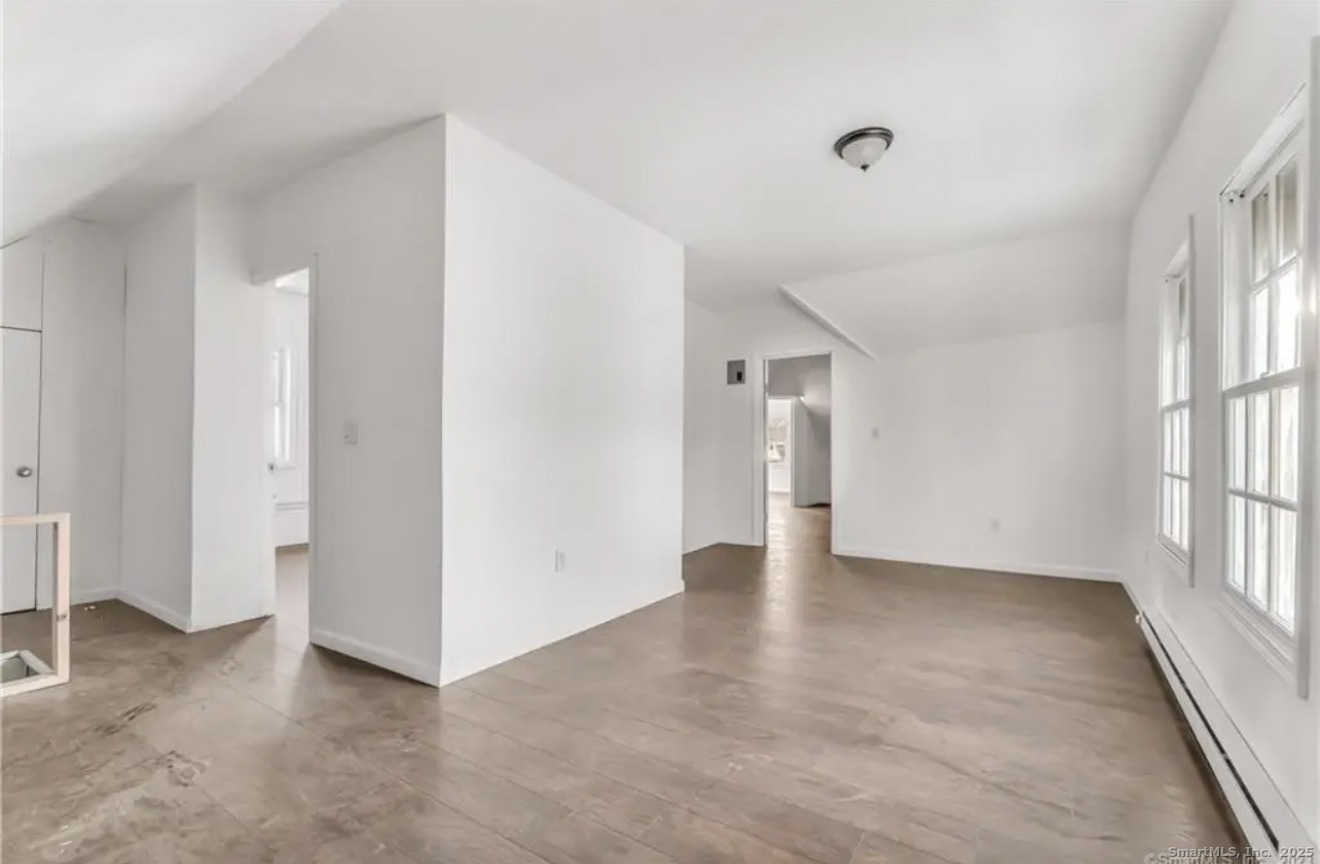 74 Carleton Avenue Bridgeport, CT 06604 - Photo 2 of 15 a view of an empty room with a window