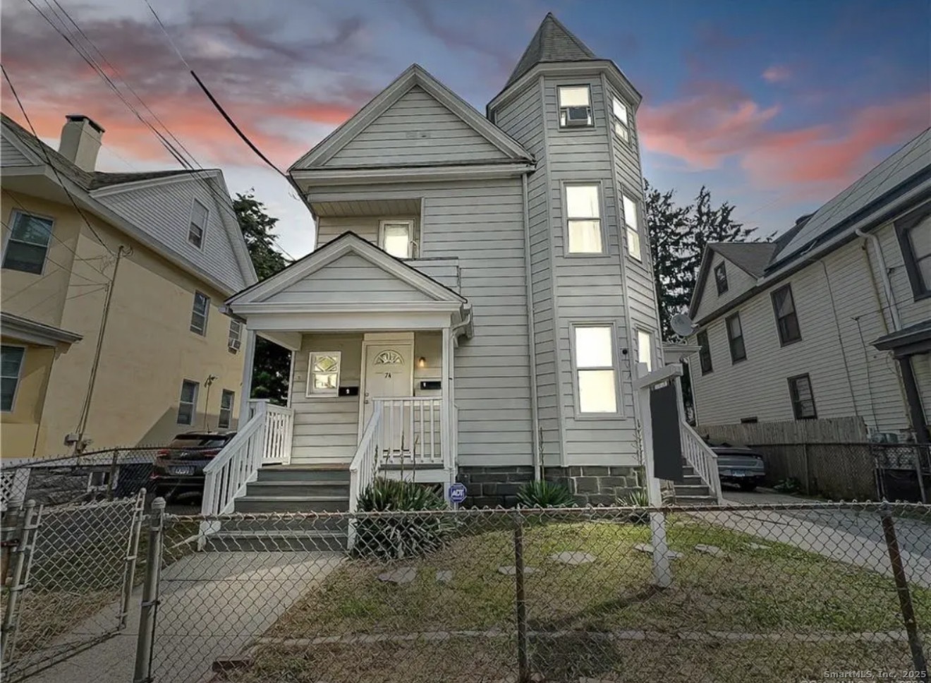 74 Carleton Avenue Bridgeport, CT 06604 - Photo 3 of 15 a front view of a house with a porch